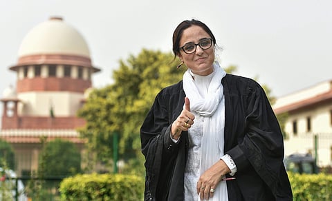 Kathua rape victim's lawyer Deepika Singh Rajawat shows victory sign after Supreme Court directed fast-track trial and transfer of the Kathua gang-rape and murder case to Pathankot in New Delhi on Monday. | PTI