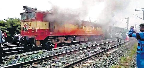 Smoke emanating from the engine of the Sapthagiri Express on Friday. | Express Photo Services