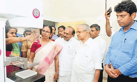 Health Minister K K Shailaja checking the functioning of the new mammogram unit at Cochin Cancer Research Centre. MLA V K Ebrahimkunju looks on