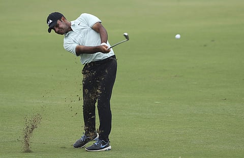 Shubhankar Sharma of India plays a shot on the 18th hole during the third round of the DP World Tour Championship golf tournament in Dubai. (Photo: AP)