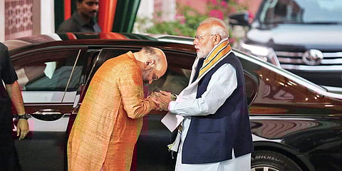 BJP chief Amit Shah welcomes PM Narendra Modi for the BJP’s central election committee meeting for Rajasthan and MP polls on Thursday. | (Shekhar Yadav | EPS)