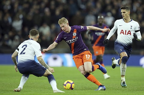Manchester City's Kevin De Bruyne, center, runs with the ball during the English Premier League soccer match between Tottenham Hotspur and Manchester City at Wembley stadium in London, England, Monday, Oct. 29, 2018. | AP