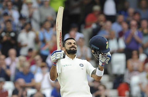 Indian captain Virat Kohli celebrates after scoring a century during the third day of the third Test match between England and India at Trent Bridge in Nottingham, England, Monday, Aug. 20, 2018. | AP