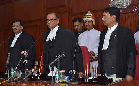 Shatrughana Pujahari (L) and Dr Akshaya Kumar Mishra (R) with Orissa HC Chief Justice KS Jhaveri (C). (Photo: Twitter/ Pragativadi )