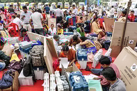 Raipur Poll officials collect election material at a distribution centre a day before the second phase of Chhattisgarh Assembly elections. (Photo | PTI)