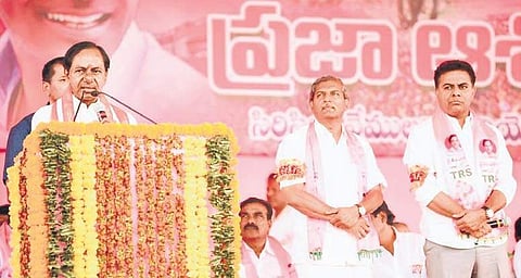 TRS president K Chandrasekhar Rao addressing an election meeting in Sircilla on Tuesday. Party candidates KT Rama Rao (Sircilla) and Chennamaneni Ramesh (Vemulawada) are also seen | Express PHOTO