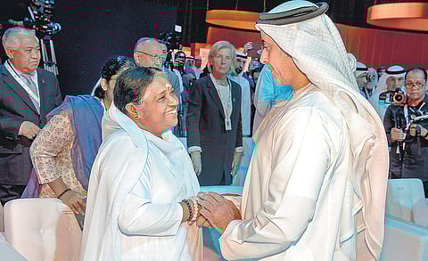 United Arab Emirates Deputy Prime Minister and Interior Minister Sheikh Saif Bin Zayed Al Nahyan with Mata Amritanandamayi at the Interfaith Alliance Summit at Abu Dhabi on Tuesday