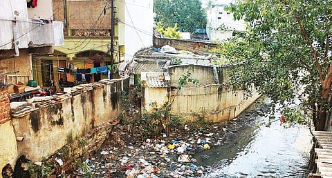 An open drain clogged with garbage flows in Chintal Basti under Khairatabad constituency limits, in Hyderabad on Wednesday | Sathya Keerthi