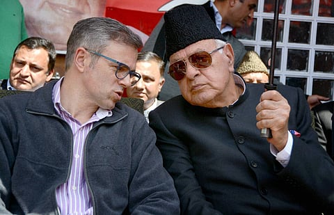 National Conference chief Farooq Abdullah R with son Omar Abdullah. | (File | PTI)