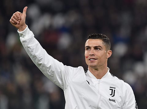 Juventus' Cristiano Ronaldo gives the thumb-up sign as he sports a red sign on his face on the occasion of the day against violence on women, prior to a Serie A soccer match between Juventus and SPAL on November 24, 2018. (Photo | AP)