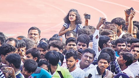 A young fan waits to get a last glimpse of Ambareesh at Kanteerava Stadium on Sunday | Pandarinath B