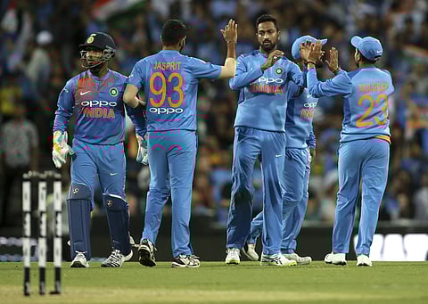India's Krunal Pandya, centre, is congratulated by teammates after taking the wicket of Australia's Australia's Glenn Maxwell during their Twenty20 cricket match in Sydney, Sunday, Nov. 25, 2018. | AP