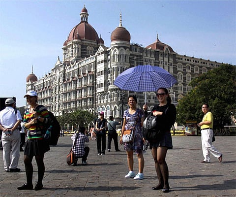 Foreign tourists outside the Taj Hotel, one of the targets during the 26/11 terror attacks, in Mumbai. (File | PTI)