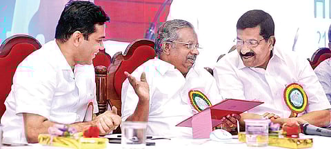 Dairy Development Minister K Raju, Milma chairman P T Gopala Kurup and Hibi Eden MLA sharing a light moment during the National Milk Day celebration and Dr Varghese Kurian Commemoration Day on Monday (EPS | A Sanesh)