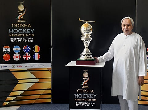 CM Naveen Patnaik with a replica of Odisha Hockey Men’s World Cup trophy in Bhubaneswar ( Photo | EPS/Irfana)