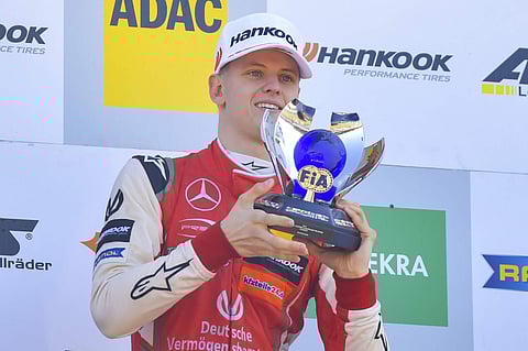 Mick Schumacher, son of former multiple Formula One champion Michael Schumacher raises the trophy as overall winner in FIA Formula 3 European Championships at Germany's Hockenheim (File photo | AP)