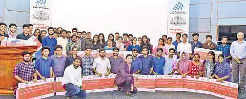 Winners of the grand finale of the Startup Yatra with Kerala Startup Mission CEO Saji Gopinath in Technopark, Thiruvananthapuram on Tuesday | Express