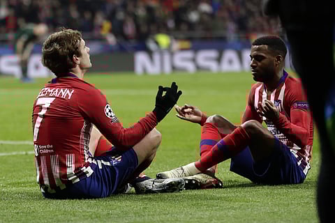 Atletico forward Antoine Griezmann (L) celebrates with his teammate Thomas Lemar after scoring his side's second goal against Monaco | AP