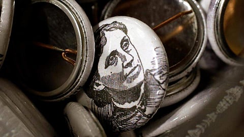 Badges with the likeness of Louisa May Alcott (Photo | AP)