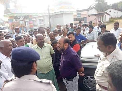 Tahsildar convincing villagers at Holebelagalu in Shivamogga taluk on Saturday. (Photo | EPS/Marx Tejaswi)