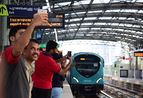 Commuters take selfies. (Photo |EPS)