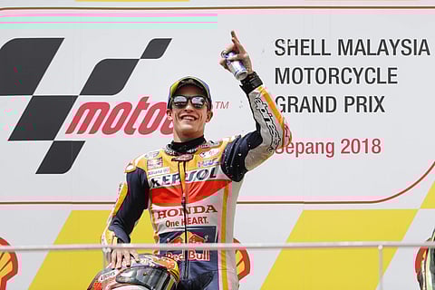 Honda rider Marc Marquez of Spain celebrates after winning the Malaysia MotoGP at the Sepang International Circuit in Sepang, Malaysia. (Photo | AP)