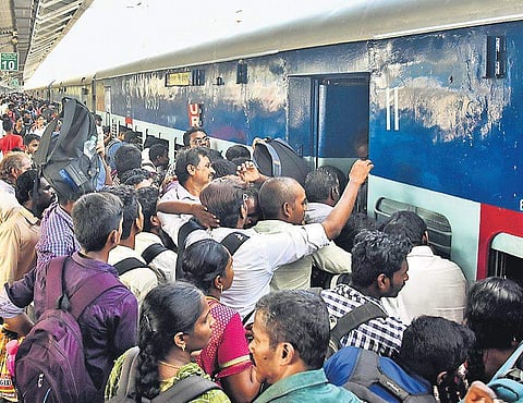 Commuters seen rushing to get into a train at Chennai Central Station ahead of Deepavali on Saturday | Ashwin Prasath