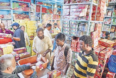 People buying crackers from a wholesale shop, on Saturday | R Satish Babu
