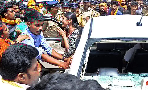 A woman reporter pleading to the protestors who attacked the vehicle that she came in to cover the Sabarimala temple. (File photo | EPS)
