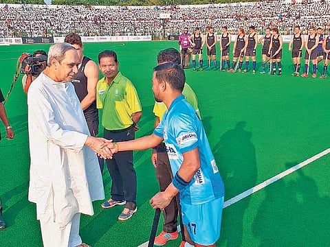 Chief Minister Naveen Patnaik greeting Odisha-XI captain Roshan Minz ahead of the exhibition match in Rourkela on Sunday | Express