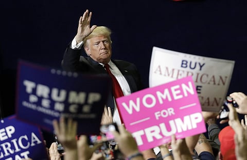 President Donald Trump acknowledges the crowd as he leaves a rally. ( Photo | AP)