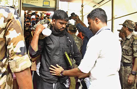 Security check being done on devotees at Pampa Guard office before they trek Sabarimala. | (Shaji Vettipuram | EPS)