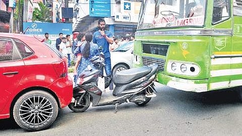 The commotion at Palarivattom Junction after a private bus rammed into a scooter, which in turn hit a car, on Monday A Sanesh