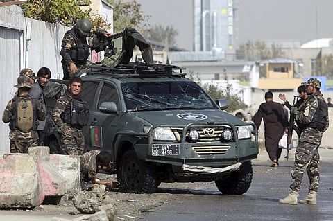 Afghan security personnel inspect the site of suicide attack near the election commission office in Kabul, Afghanistan, Monday, Oct. 29, 2018. (Photo | AP)