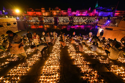 People light earthen lamps on the banks of River Saryu during Deepotsav grand Diwali celebrations in Ayodhya Tuesday November 6 2018. | PTI