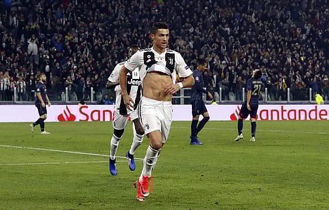 Juventus forward Cristiano Ronaldo celebrates after scoring his side's opening goal during the Champions League group H soccer match between Juventus and Manchester United at the Allianz stadium in Turin, Italy. (Photo | AP)