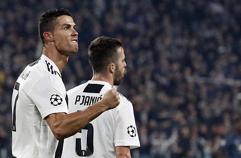 Juventus forward Cristiano Ronaldo celebrates after scoring his side's opening goal during the Champions League group H soccer match between Juventus and Manchester United at the Allianz stadium in Turin, Italy. (Photo | AP)