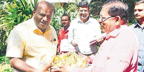 Chief Minister H D Kumaraswamy being greeted by his deputy G Parameshwara on the occasion of Deepavali in Bengaluru on Wednesday | Express