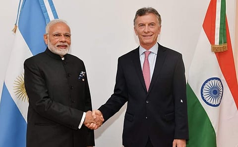 PM Modi with President Mauricio Macri . (Photo | Twitter/@@narendramodi)