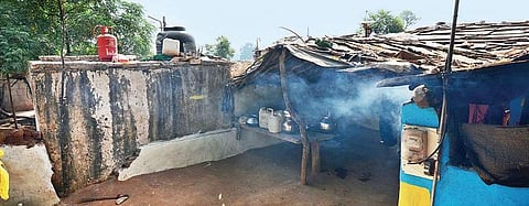 Smoke from a chulha in a house in Kalmi village in Sheopur district, while an LPG cylinder lies perched on the roof of the outdoor toilet. | (Naveen Kumar | EPS)
