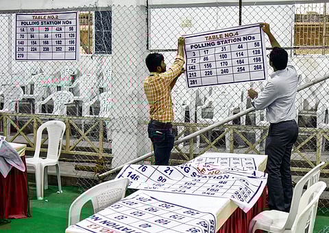 Officers on election duty making arrangements at the Amberpet GHMC ground counting center (Photo | EPS/ Vinay Madapu)