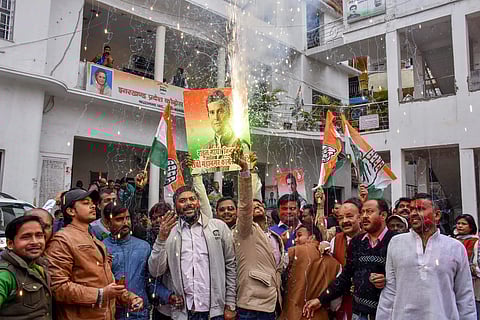 Congress workers burst fire crackers to celebrate the party's performance in Assembly elections in Rajasthan Chhattisgarh and Madhya Pradesh in Ranchi Tuesday Dec. 11 2018. | PTI