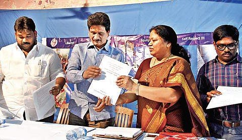 Dalit Sthree Sakthi State convenor Geddam Jhansi releasing a booklet on gender-based violence in city on Monday | EXPRESS