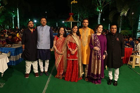 Isha Ambani (center left) and Anand Piramal with family members during a pre-wedding event. (Photo | Reliance Industries)
