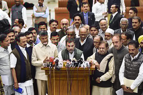 Congress president Rahul Gandhi flanked by leaders of 21 opposition parties in Delhi on Monday (Photo | EPS/Shekhar Yadav)