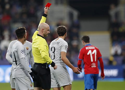 Referee Anthony Taylor gives red card to AS Roma's Luca Pellegrini during the Champions League group G soccer match between Viktoria Plzen and Roma (Photo | AP)