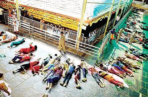 Devotees performing ‘Ede Snana’ at Kukke Subrahmanya temple in Dakshina Kannada district on Thursday | Express