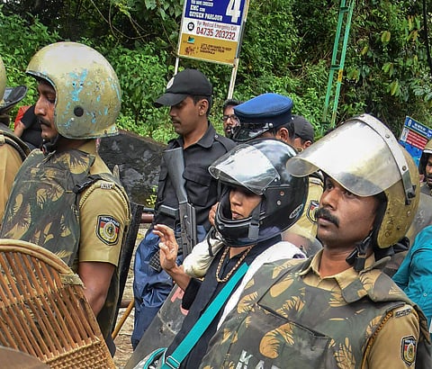 Rehana Fathima being escorted by the Kerala police to Sabarimala temple. (File photo | PTI)