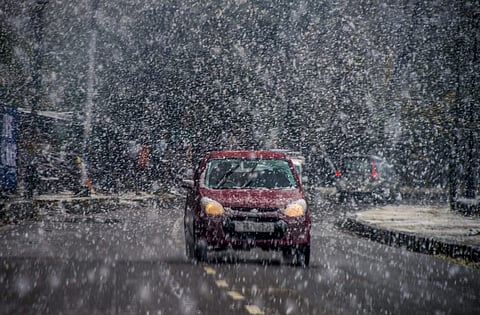 File image of A vehicle moves during season's first snowfall in Srinagar Saturday Nov 3 2018. | PTI