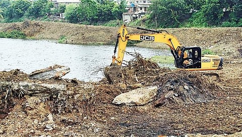Restoration work underway at Adambakkam lake on Sunday. | (Tamizharasi Kannan | EPS)